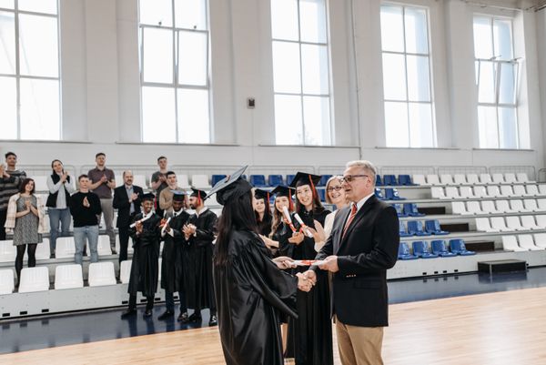 New nurse graduate receiving diploma