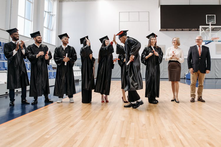 Photo Of People Doing High Five