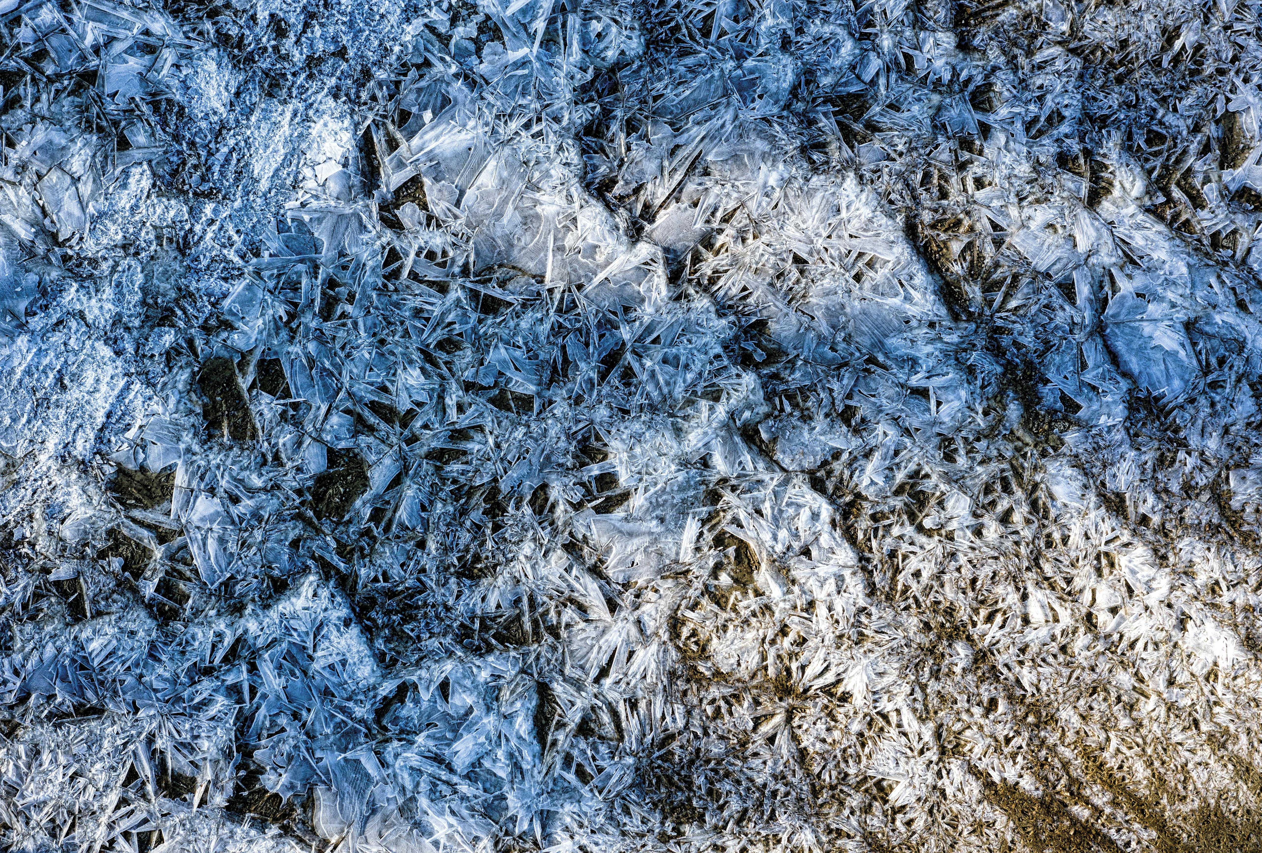 Outdoor condenser unit with ice buildup on the copper refrigerant lines - signs your ac needs repair