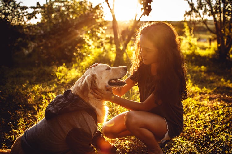 Pretty Girl Holding Golden Retriever