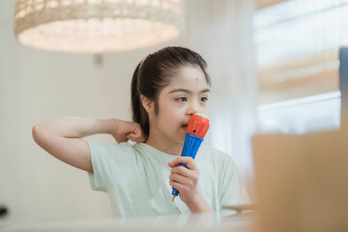 Close-Up Shot of a Girl Holding a Toy 