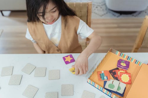 High-Angle Shot of a Girl Holding Cards