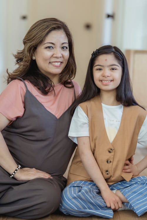 Mother and Daughter Smiling at the Camera