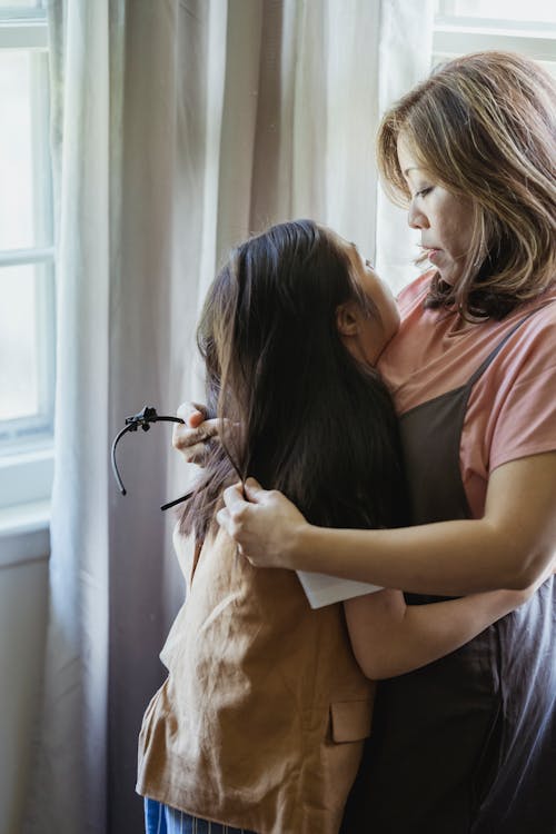 Free Mother and Daughter Hugging Each Other Stock Photo