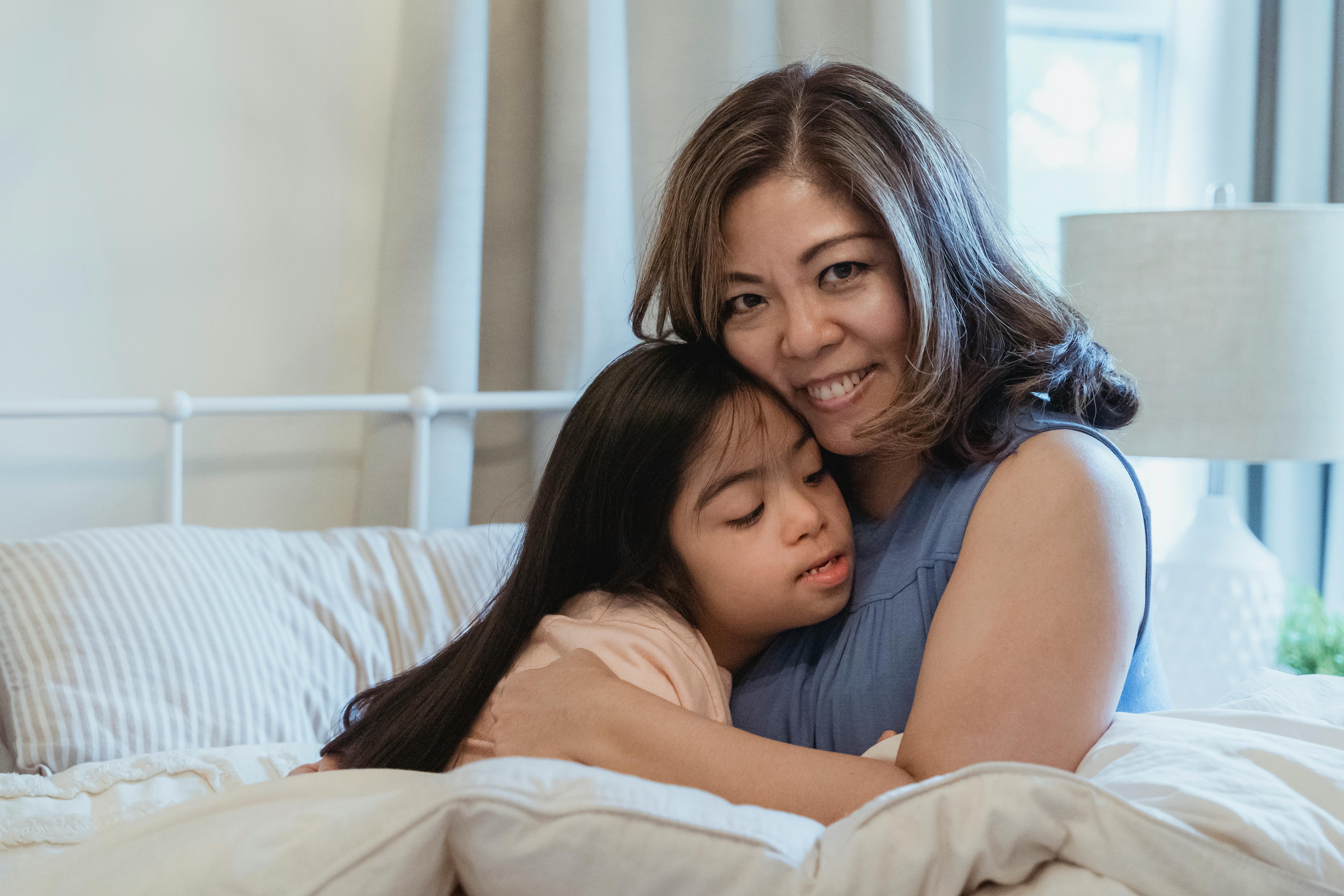 mother and daughter hugging each other