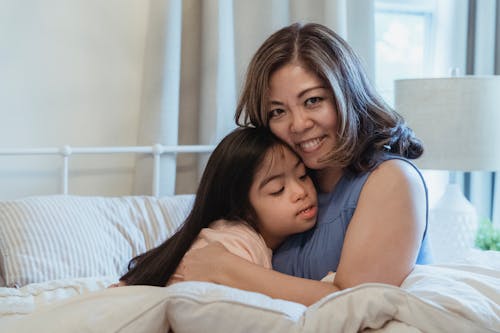 Free Mother and Daughter Hugging Each Other Stock Photo