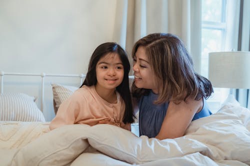 Free Mom Taking Care of Her Daughter Stock Photo