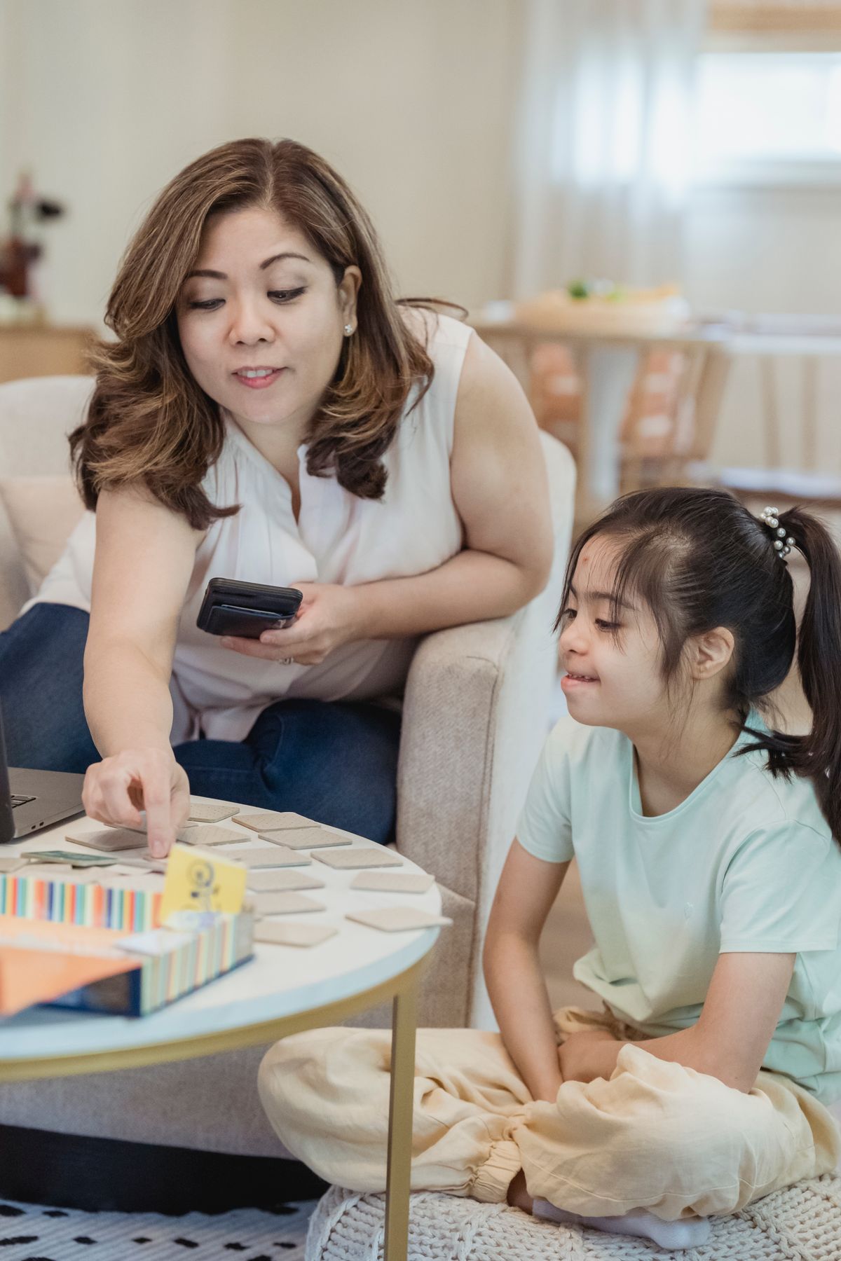 Mom and daughter playing a card game