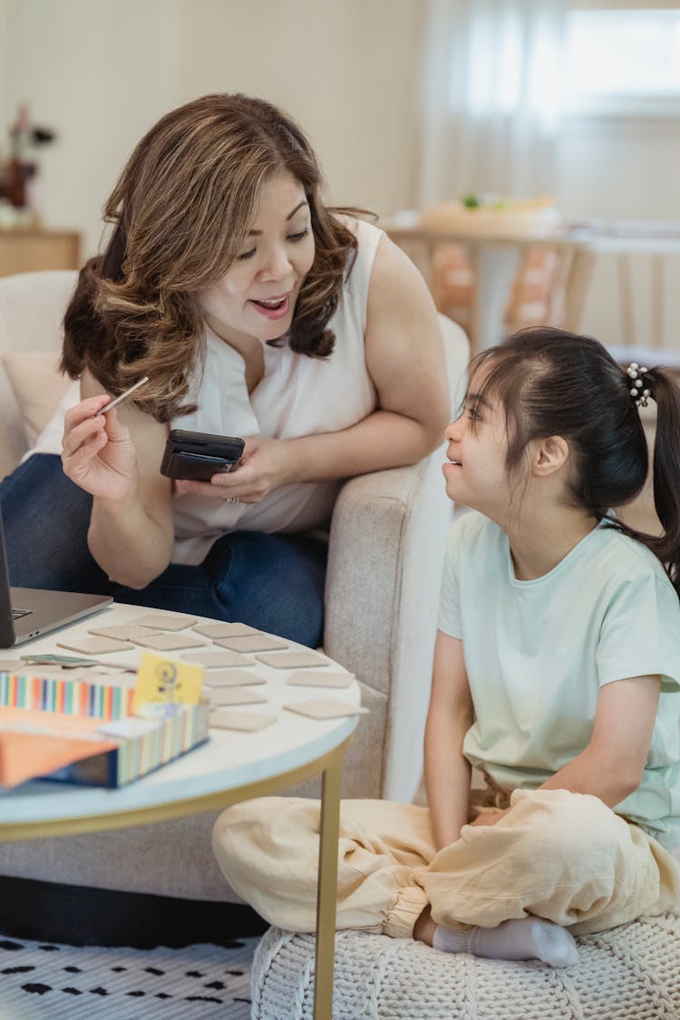 Mom And Daughter Playing Card Game