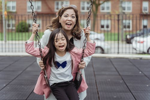 Mother and Daughter on Swing