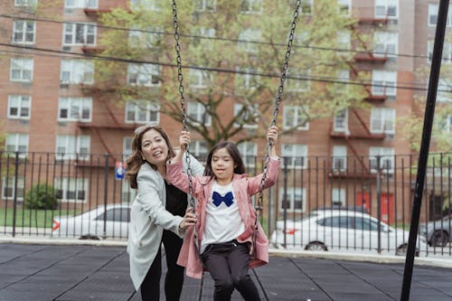 Mother and Daughter Playing on a Playground