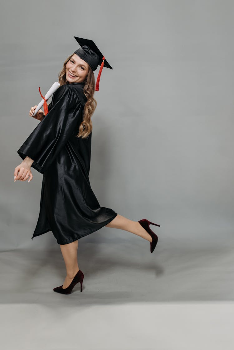 Photo Of Happy Woman Holding Diploma