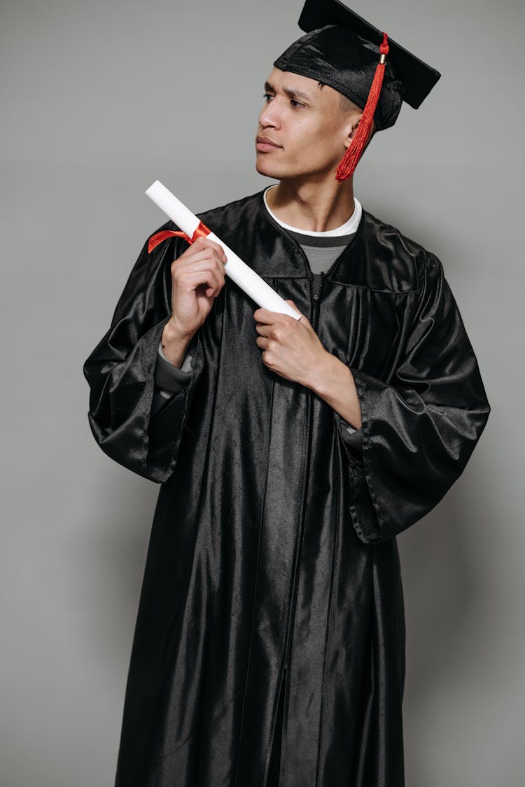 Photo Of Goofy Man Holding Diploma