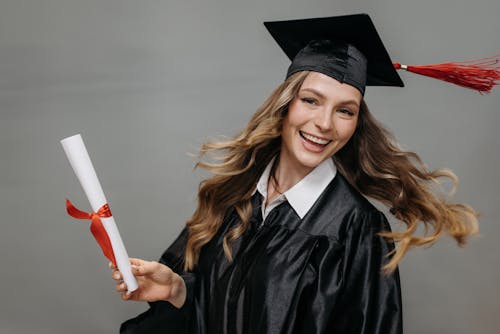 Free Photo of Happy Woman Holding Diploma Stock Photo