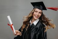 Photo of Happy Woman Holding Diploma