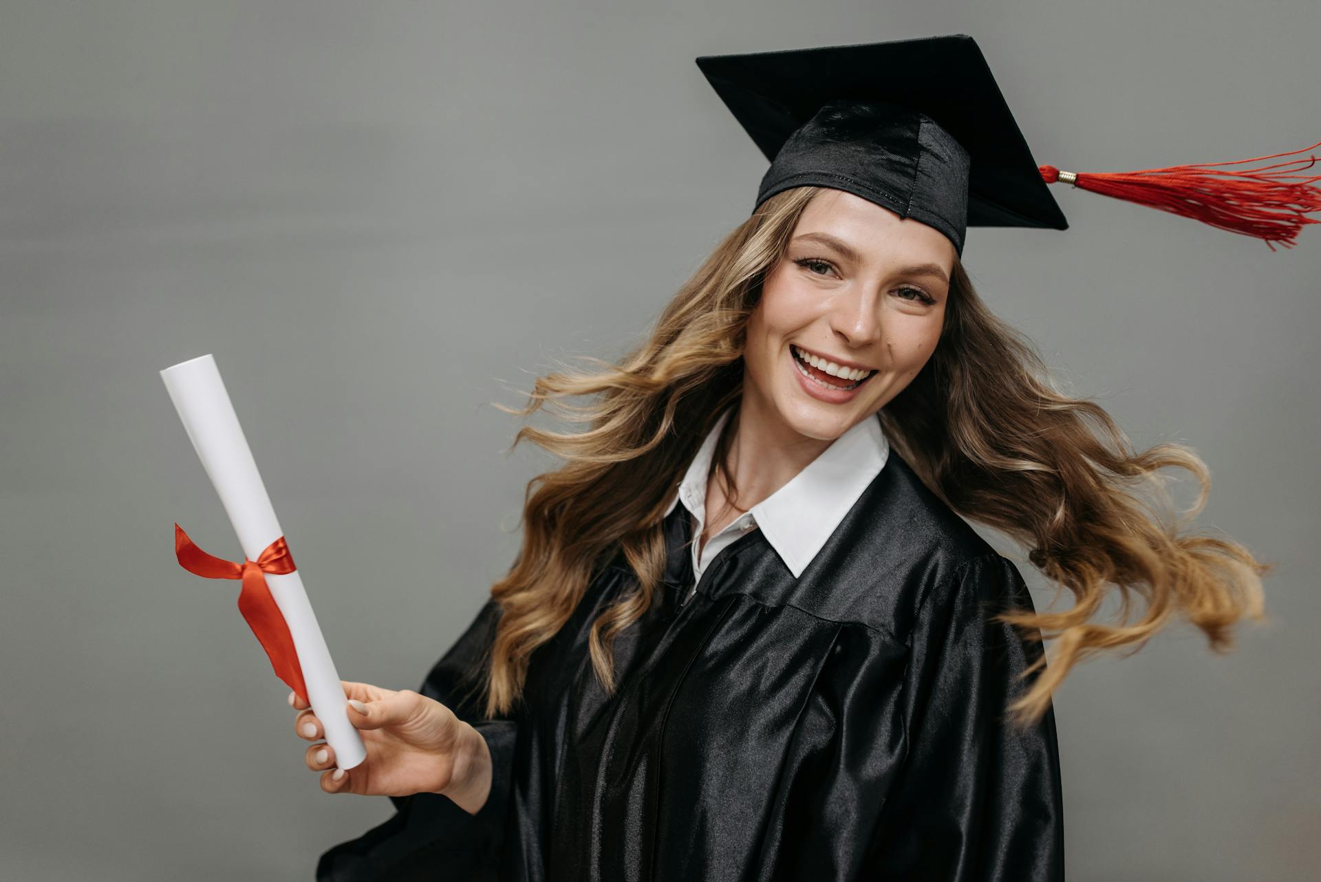 Photo of Happy Woman Holding Diploma