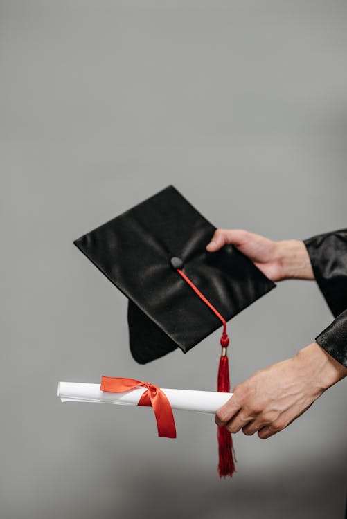 Free Photo of Person Holding Black Academic Hat Stock Photo