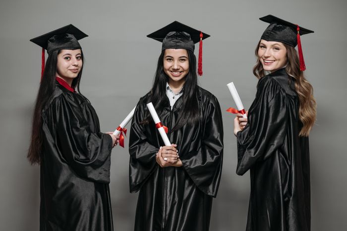 Delta chapter members in caps and gowns