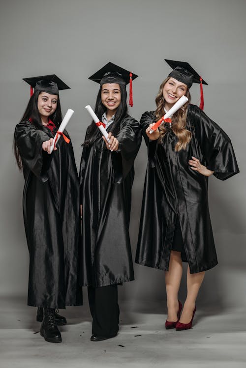 Free Photo of Fresh Graduates Holding Diploma Stock Photo