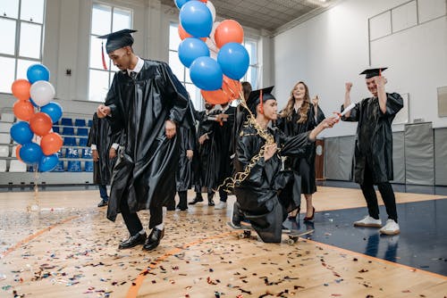 Photo of People Celebrating in Gym 