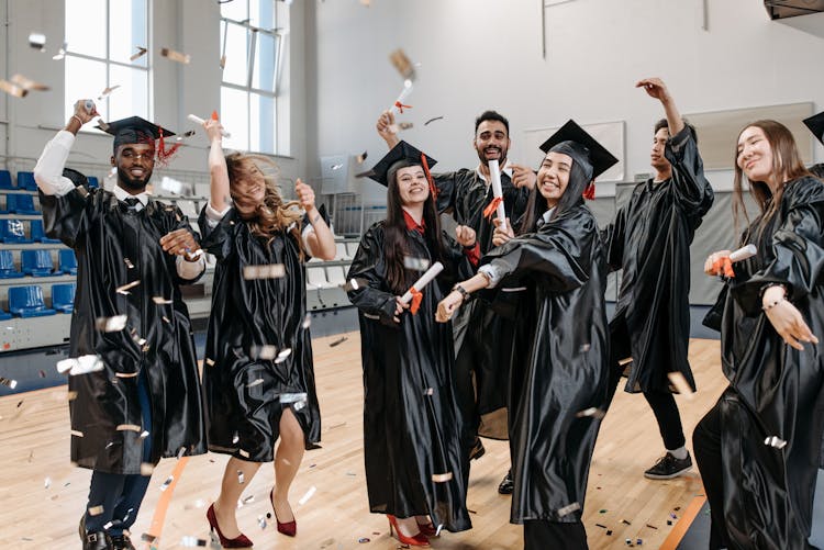 Photo Of Fresh Graduates Celebrating In Gym 