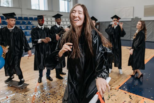 Photo of Woman Wearing Graduation Gown 