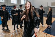 Photo of Woman Wearing Graduation Gown