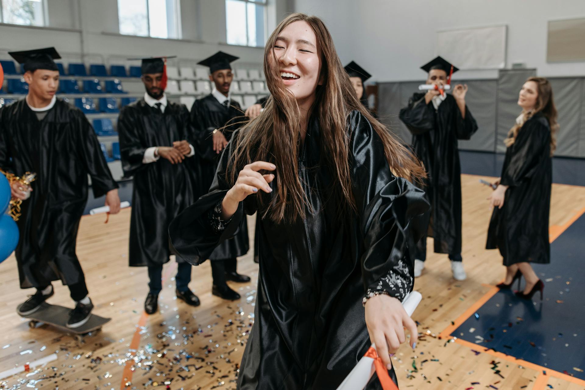 Photo of Woman Wearing Graduation Gown 