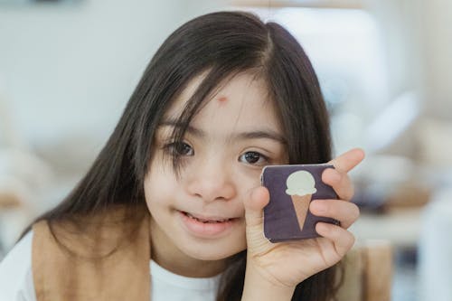 Portrait of Little Girl Holding Memory Game Cards