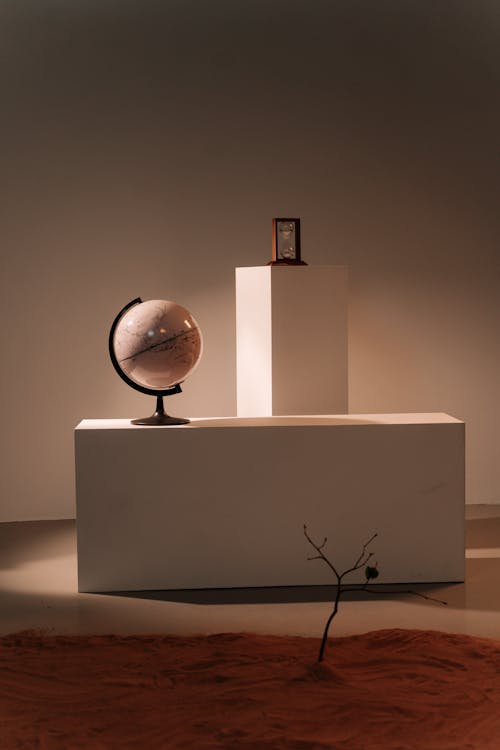 Brown and White Desk Globe on White Wooden Table