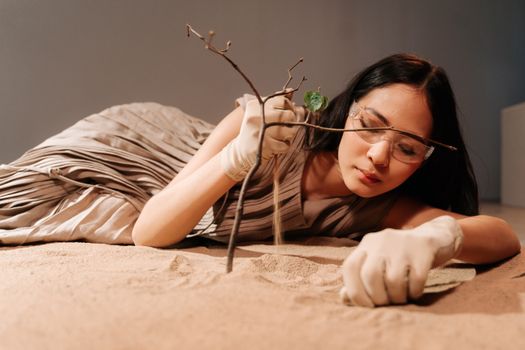 Woman Pouring Sand from Hand