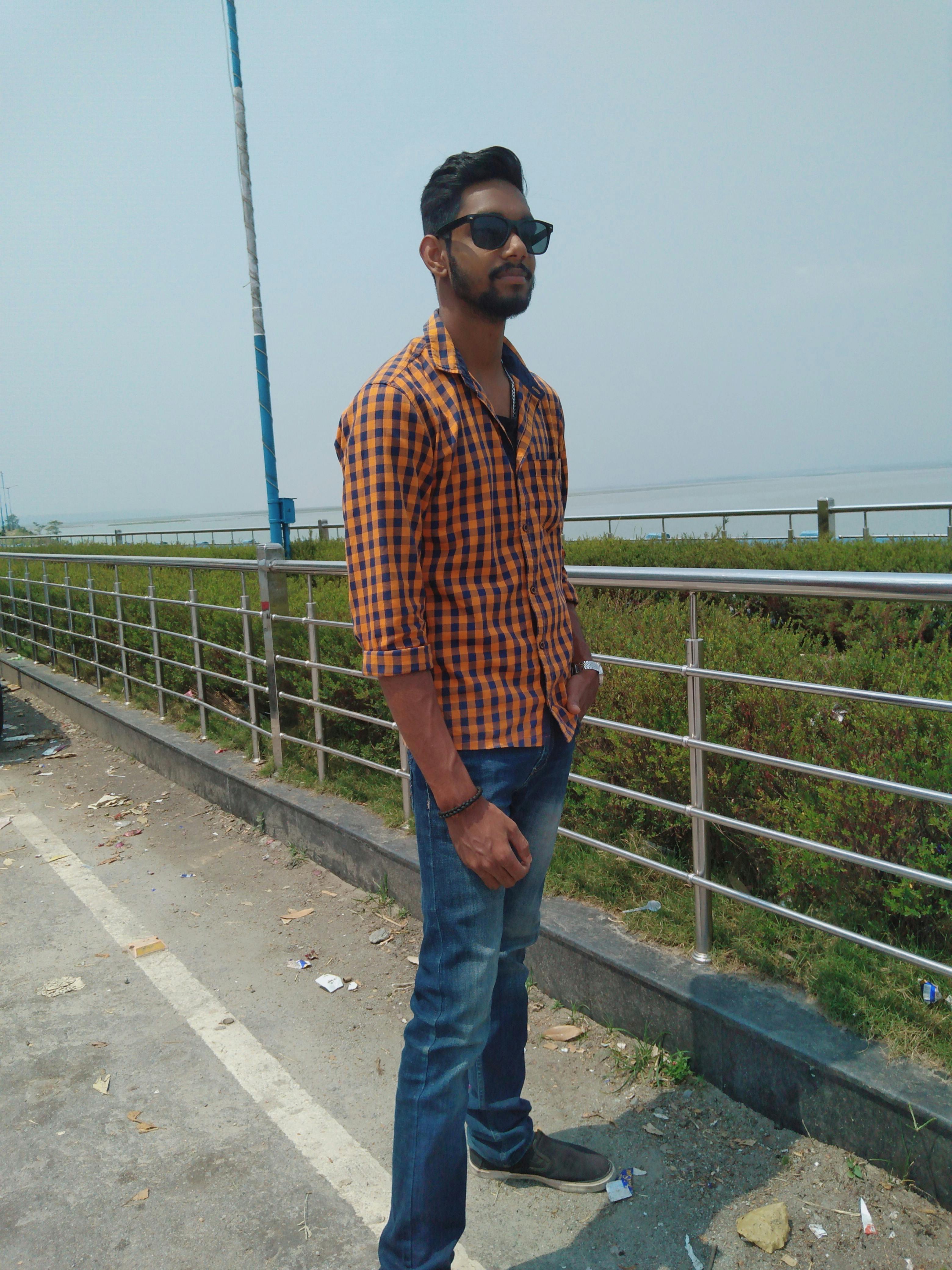 Person sitting on a couch wearing a VR headset while watching immersive media content