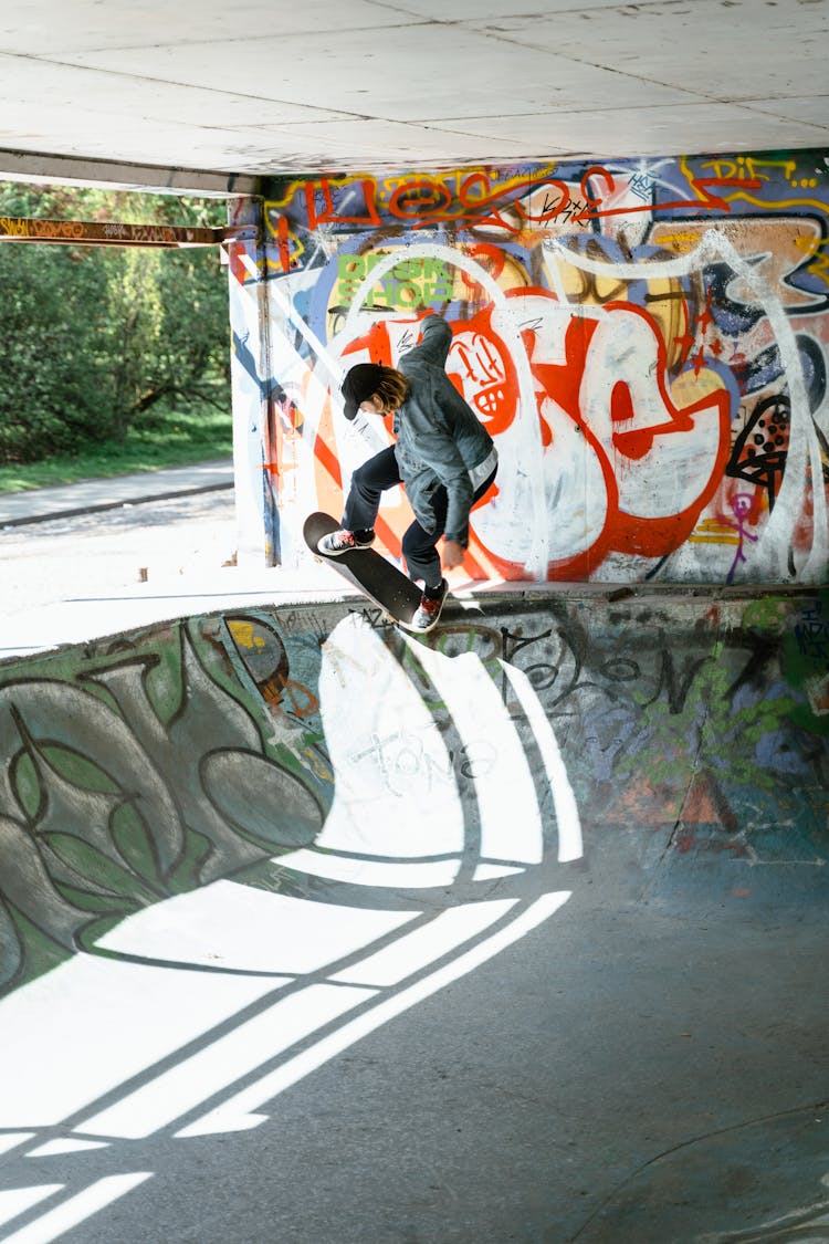 A Man Skateboarding On A Skate Ramp