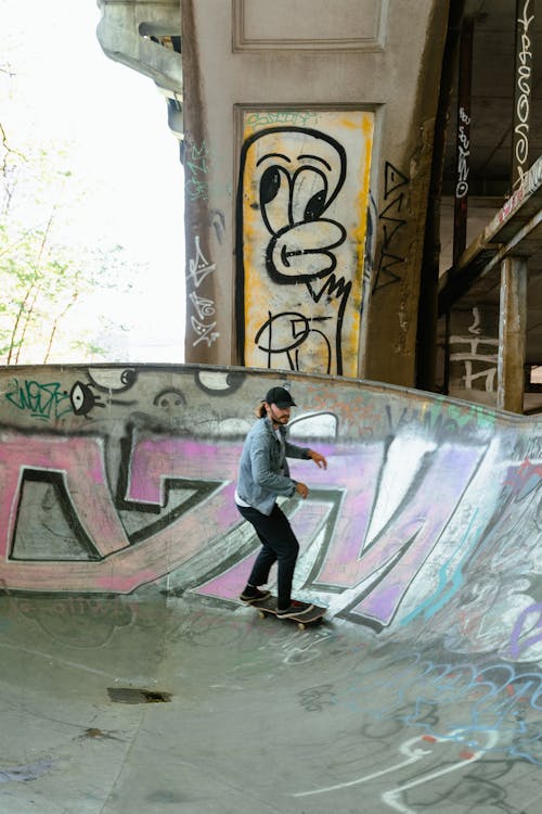 Active Man Riding Skateboard At Skatepark