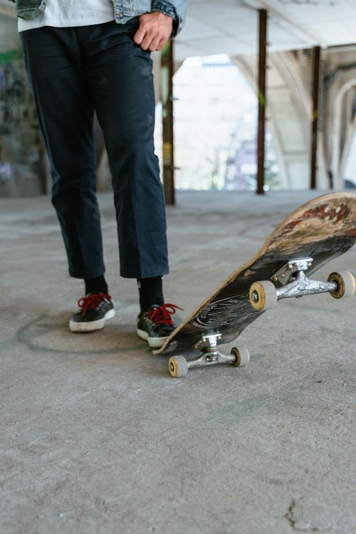 Free Close-up of skater balancing on a skateboard indoors, showcasing urban lifestyle. Stock Photo