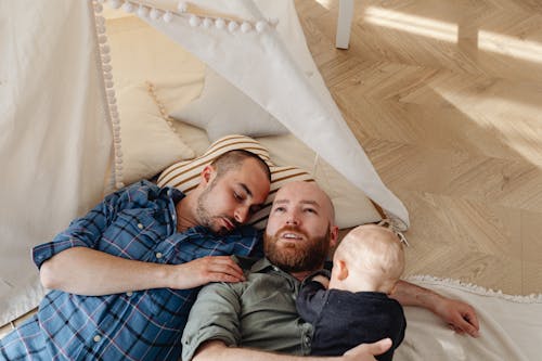 Free A Family Lying on the Floor Stock Photo
