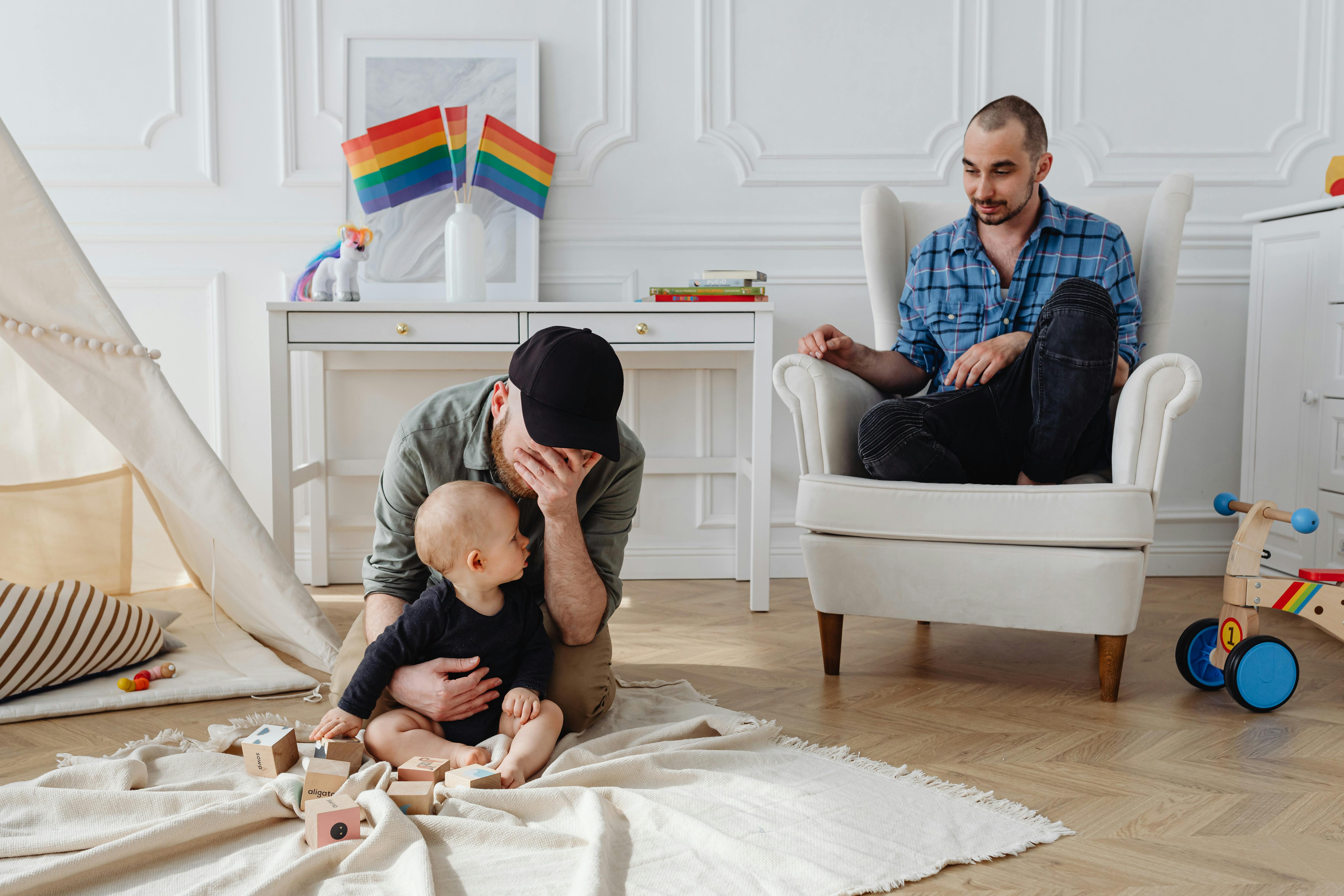 men spending time with their baby in the living room