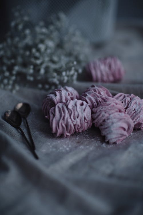 Marshmallow on cloth near flowers