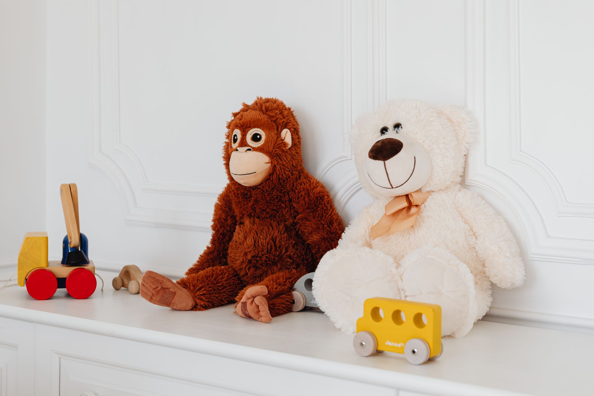 Teddy Bears Sitting on a White Surface