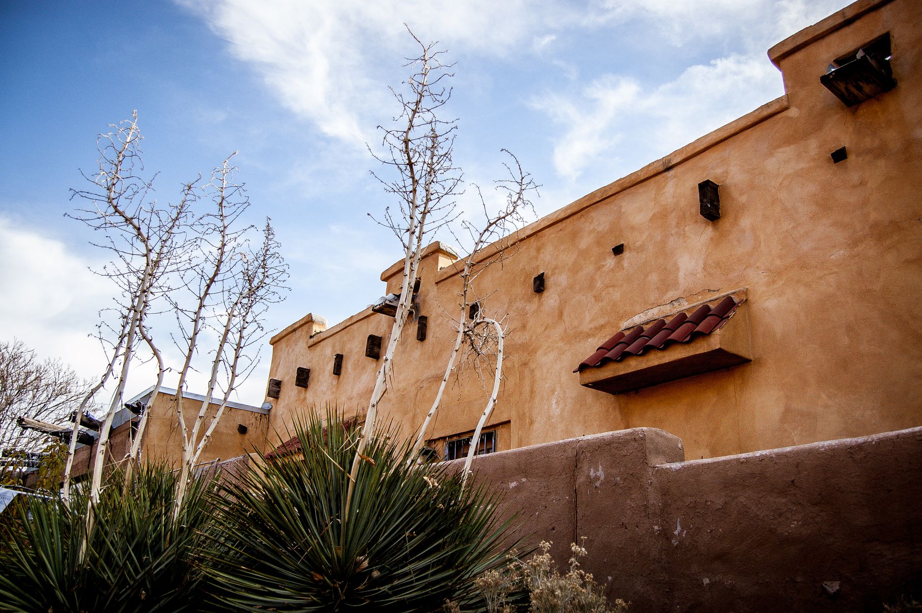 An adobe style building with a clear blue sky in Albuquerque, New Mexico