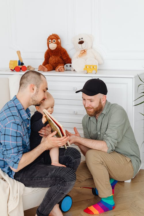 Two Men Bonding With A Baby