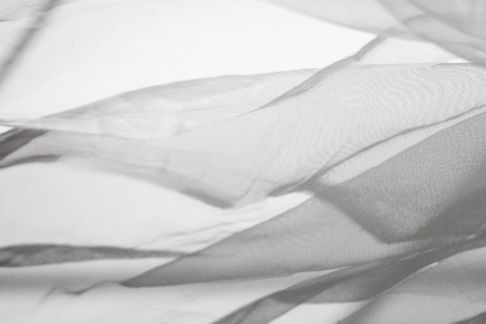 Sheer white fabric folding in soft daylight — photo by Hanna Pad on Pexels