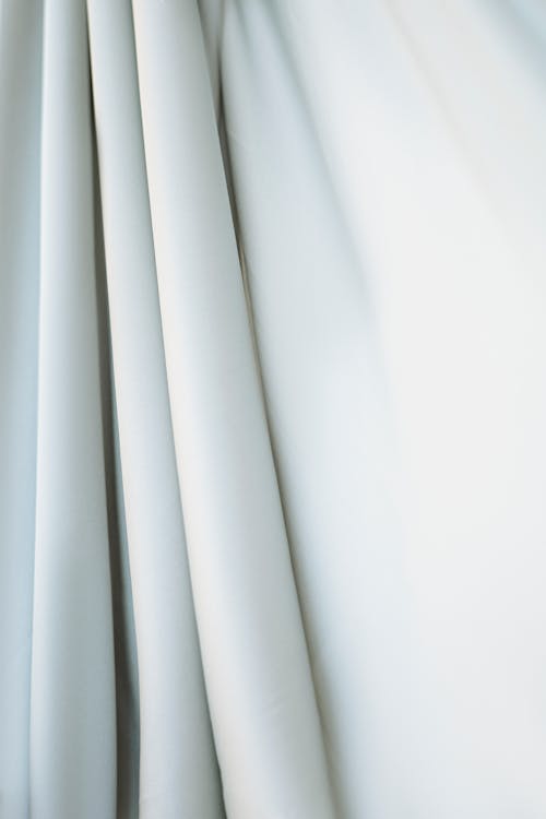 White Textile in Close Up Photography