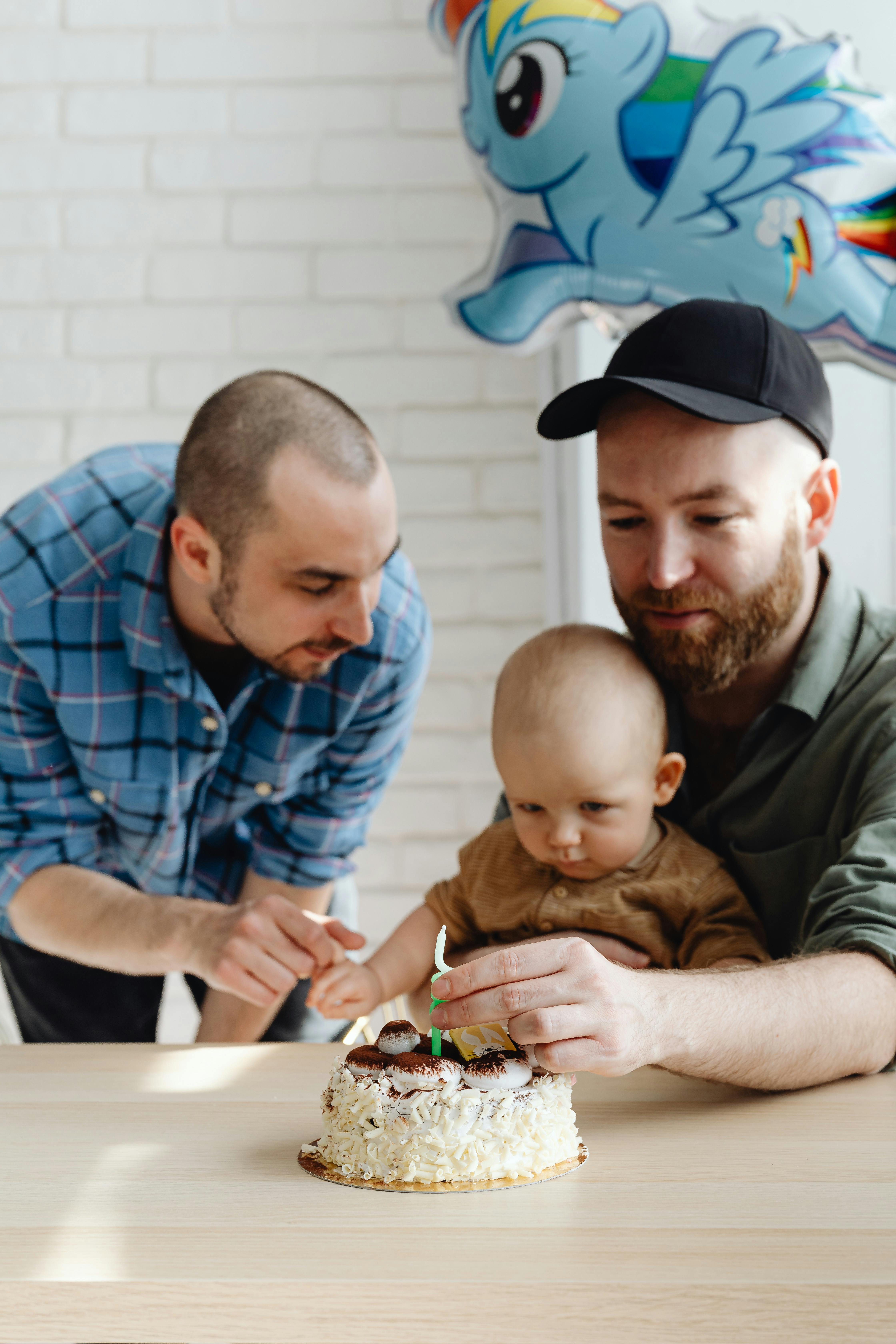 bearded man in black cup with cute baby