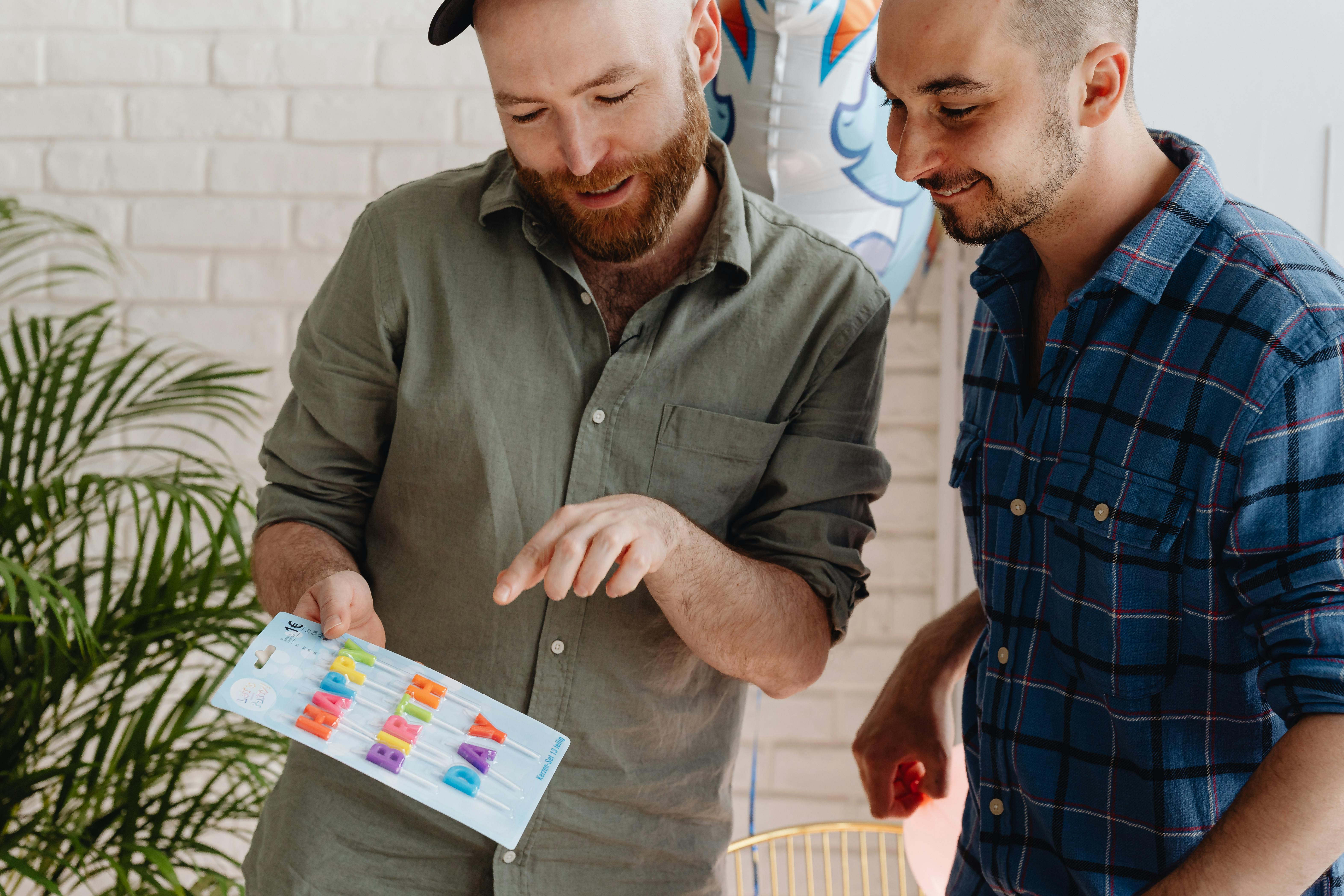 A Same Sex Couple Looking at an Object · Free Stock Photo