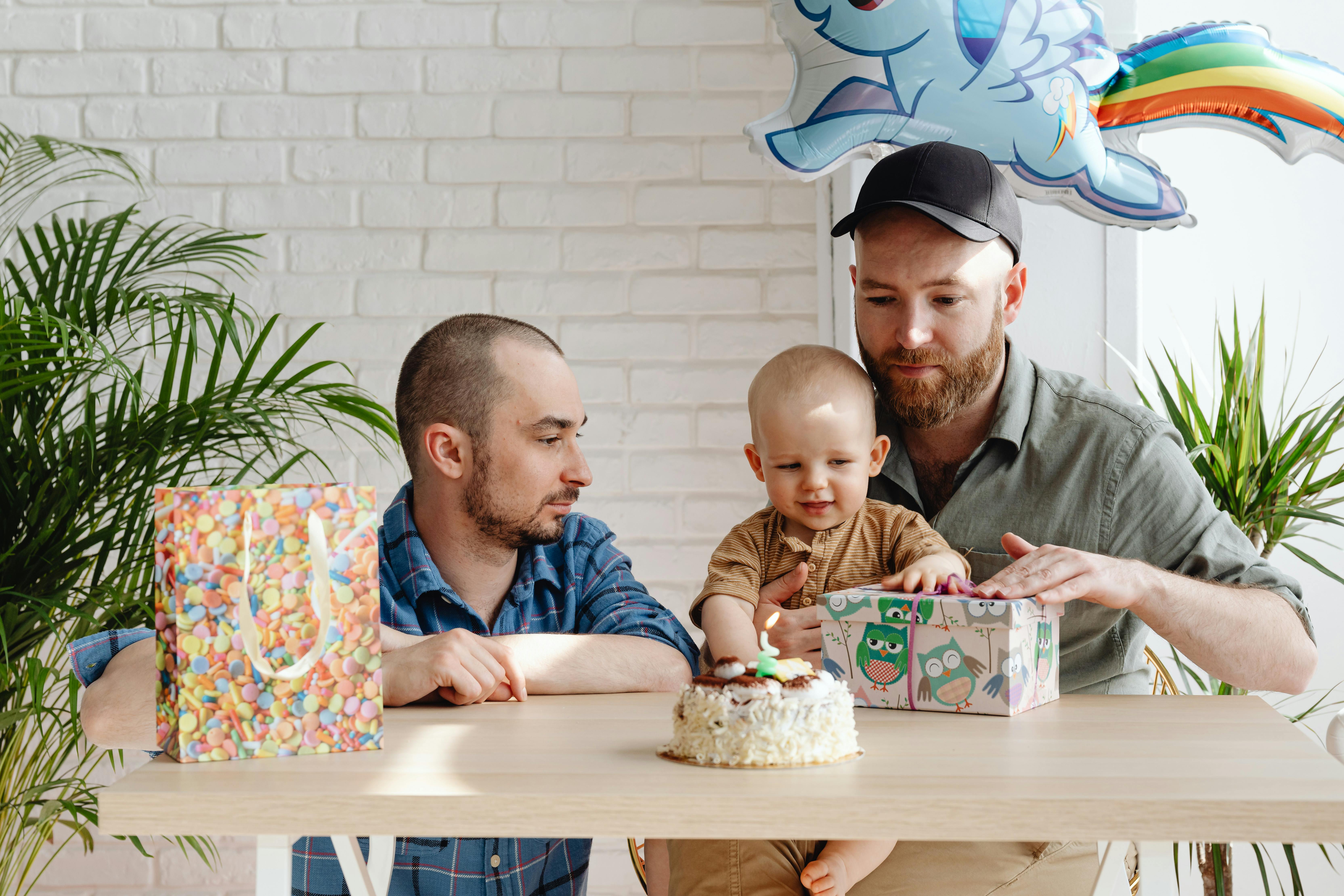 a same sex couple taking care of their son