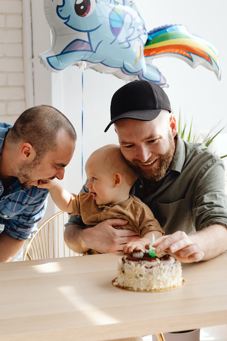 
Men Celebrating A Child's Birthday