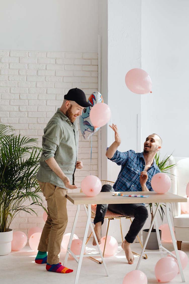 Men Playing With The Balloons