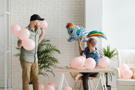Men Preparing Balloons For a Party