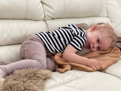 Baby in Black and White Stripe Onesie Lying on Brown Fur Textile